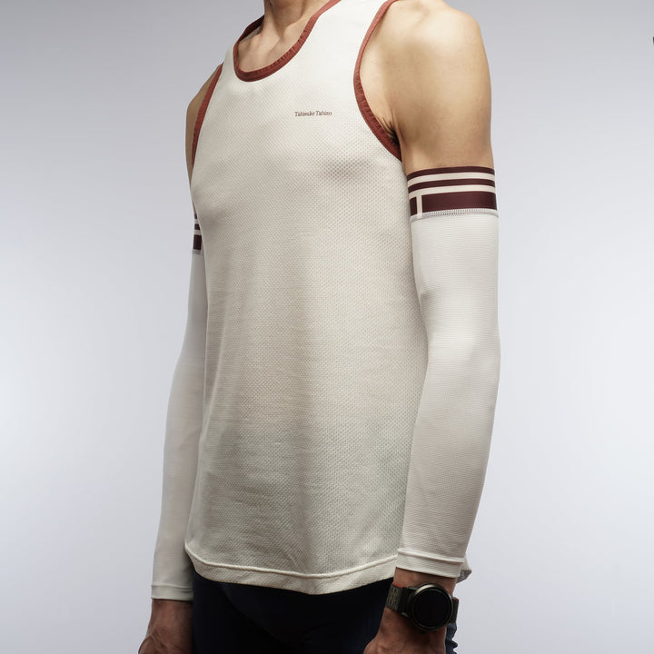 White racing arm sleeve with lightweight compression and asymmetrical design for running and racing.