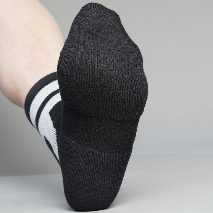 Black crew-length T2 Ultra Socks by Tabisuke Tabizo, featuring foot-mapped knit structure, arch compression, and durable fabric for trail running and fastpacking.