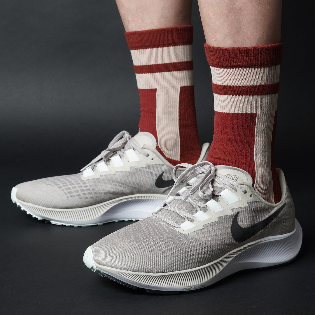 Wine crew-length T2 Ultra Socks by Tabisuke Tabizo, featuring foot-mapped knit structure, arch compression, and Dralon Cotton fabric for trail running and fastpacking.