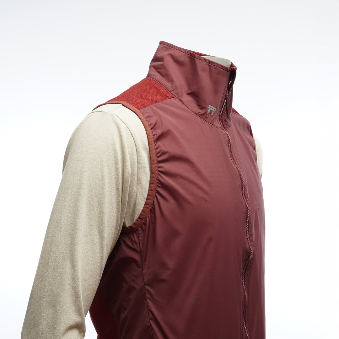 T2 Running Wind Shell Vest in bordeaux with windproof front and breathable mesh back
