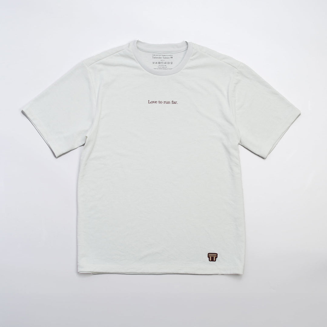 T2 - Trail Tee in white, featuring a relaxed fit and crafted from high-performance Swiftex 2 fabric, displayed on a neutral background.