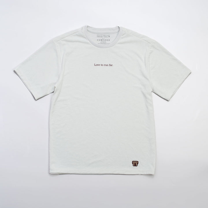 T2 - Trail Tee in white, featuring a relaxed fit and crafted from high-performance Swiftex 2 fabric, displayed on a neutral background.