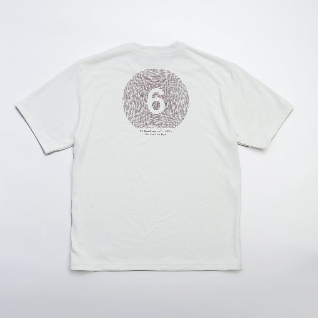 T2 - Trail Tee in white, featuring a relaxed fit and crafted from high-performance Swiftex 2 fabric, displayed on a neutral background.