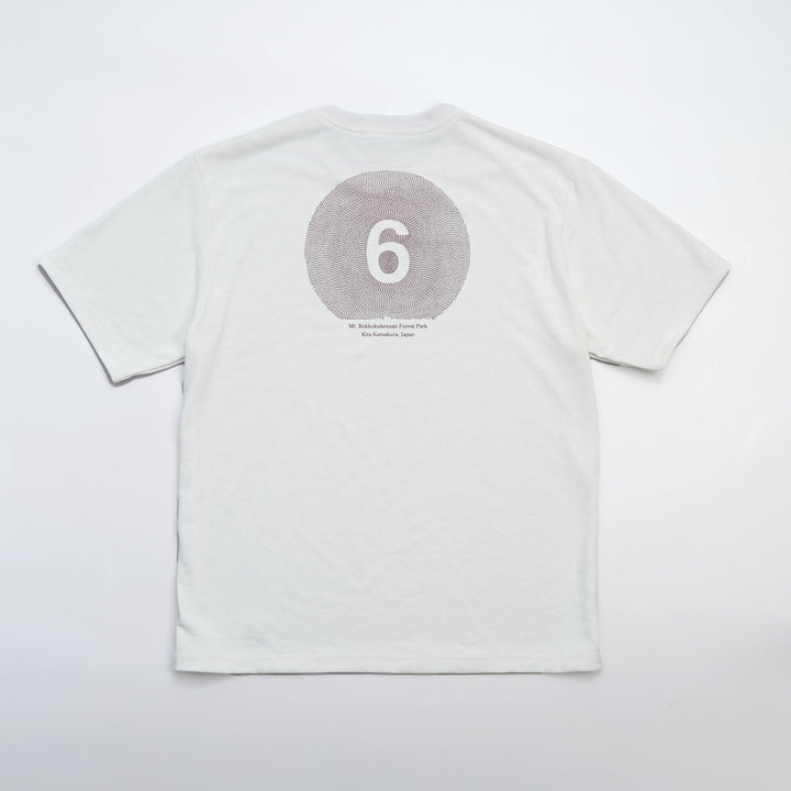 T2 - Trail Tee in white, featuring a relaxed fit and crafted from high-performance Swiftex 2 fabric, displayed on a neutral background.