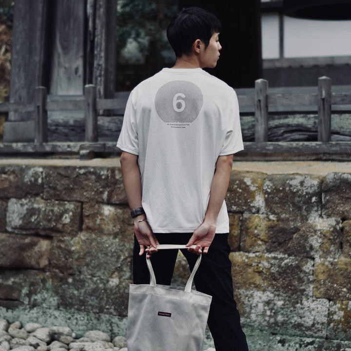 T2 - Trail Tee in white, featuring a relaxed fit and crafted from high-performance Swiftex 2 fabric, displayed on a neutral background.