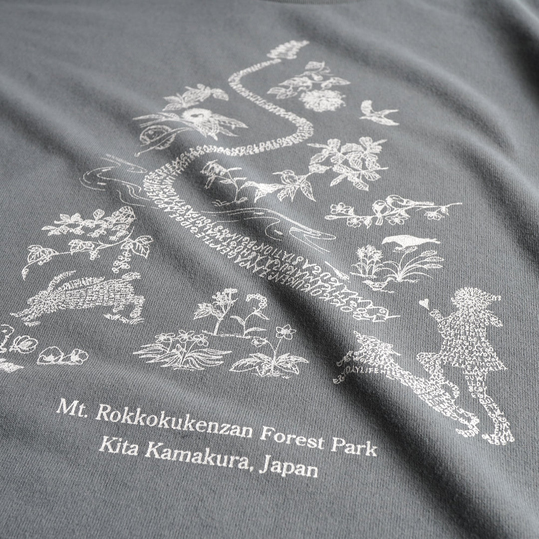 T2 - Trail Tee by Mariko Yamamoto in blue-gray, a relaxed-fit T-shirt made of high-performance fabric, suitable for outdoor activities.