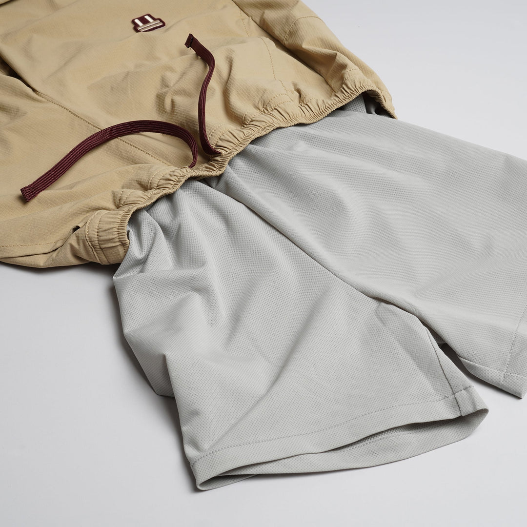 T2 Traverse Pants 2025 fastpacking pants in beige with reinforced crotch and integrated inner shorts