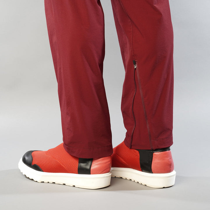 T2 Traverse Pants 2025 fastpacking pants in burgundy with reinforced crotch and integrated inner shorts