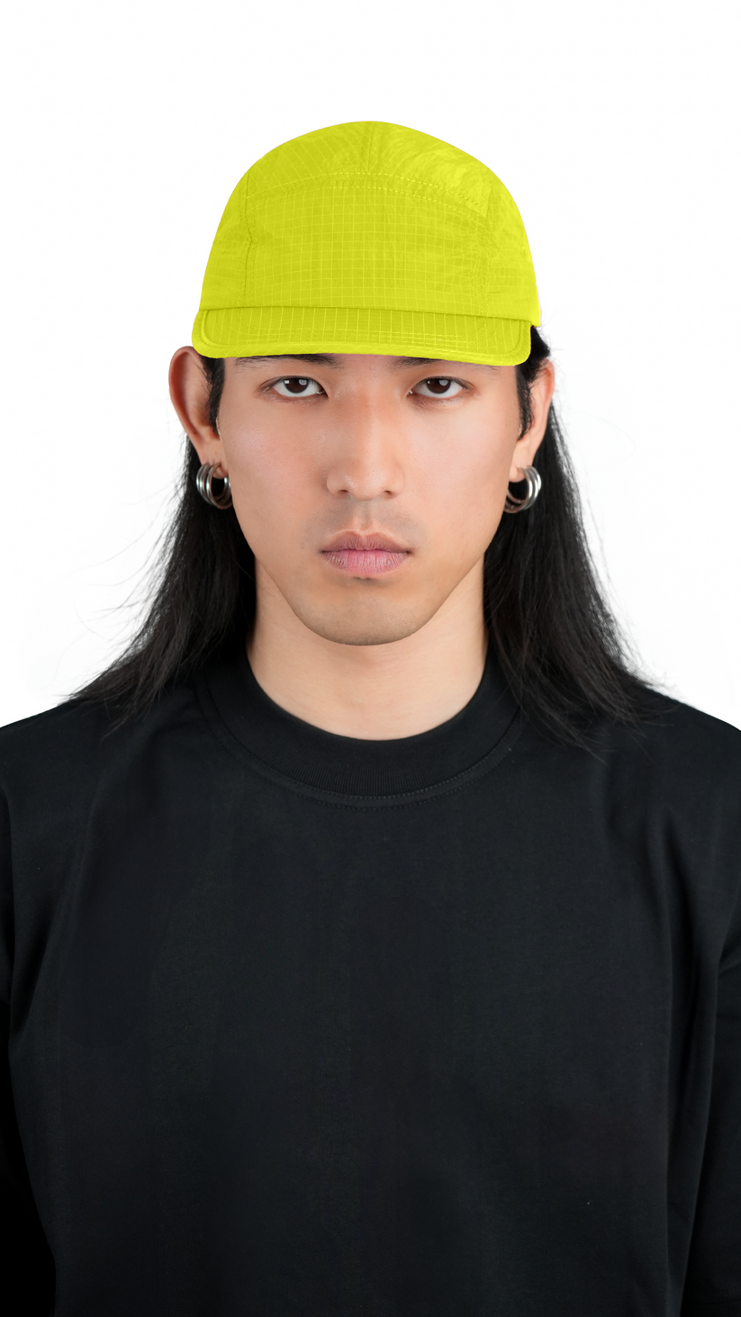 Lievre Running yellow performance running cap, lightweight technical fabric with adjustable back cord and “Engineered for the Art of Running” text on the side panel.